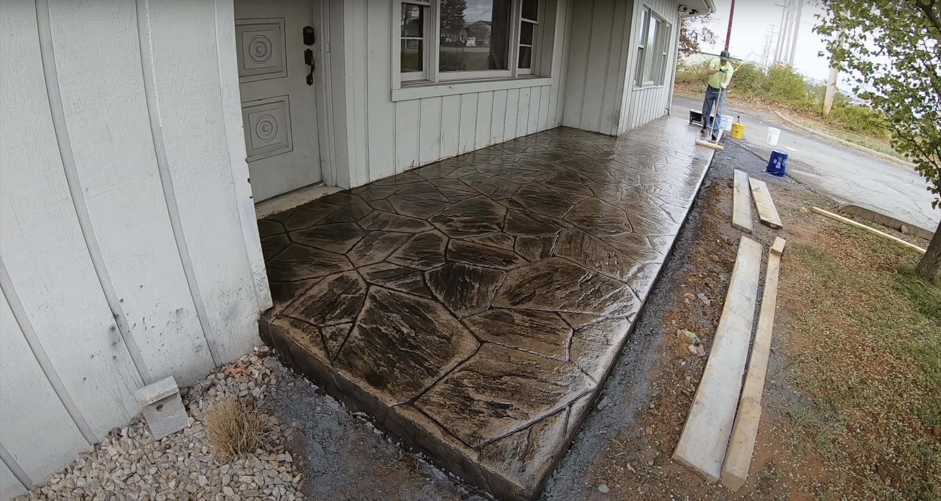 Decorative stamped concrete work by Southfield Concrete Construction Stunning stamped concrete patio with natural stone pattern showing decorative concrete capabilities