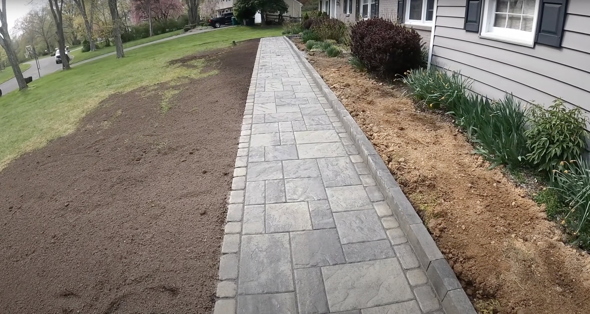 Decorative concrete walkway construction by Southfield Concrete Construction Professional concrete walkway installation with decorative stamped pattern and clean edges