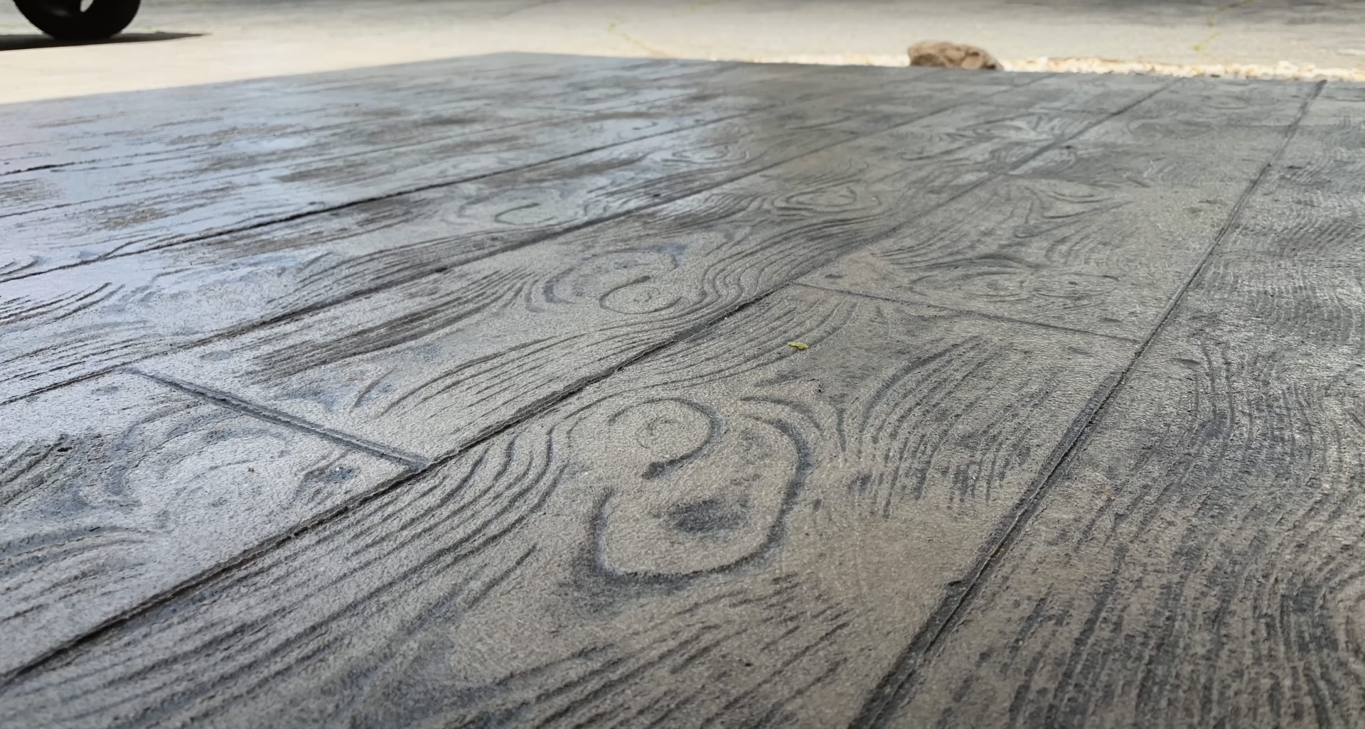 Stamped concrete with wood plank pattern - Southfield Concrete Construction Professional stamped concrete flooring with wood plank pattern showing expert finishing techniques